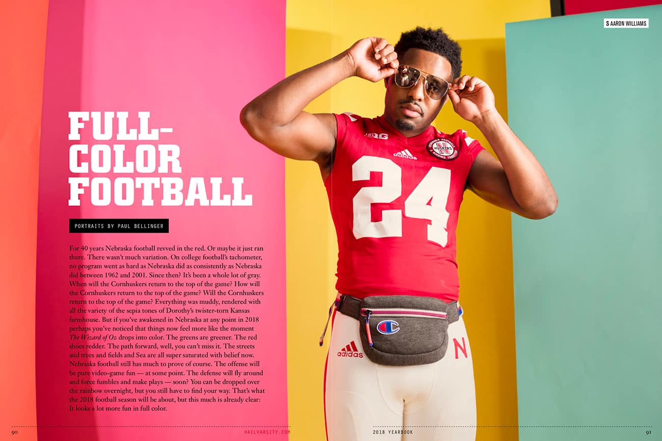 Hail Varsity Magazine yearbook spread titled Full Color Football with a Husker Football player