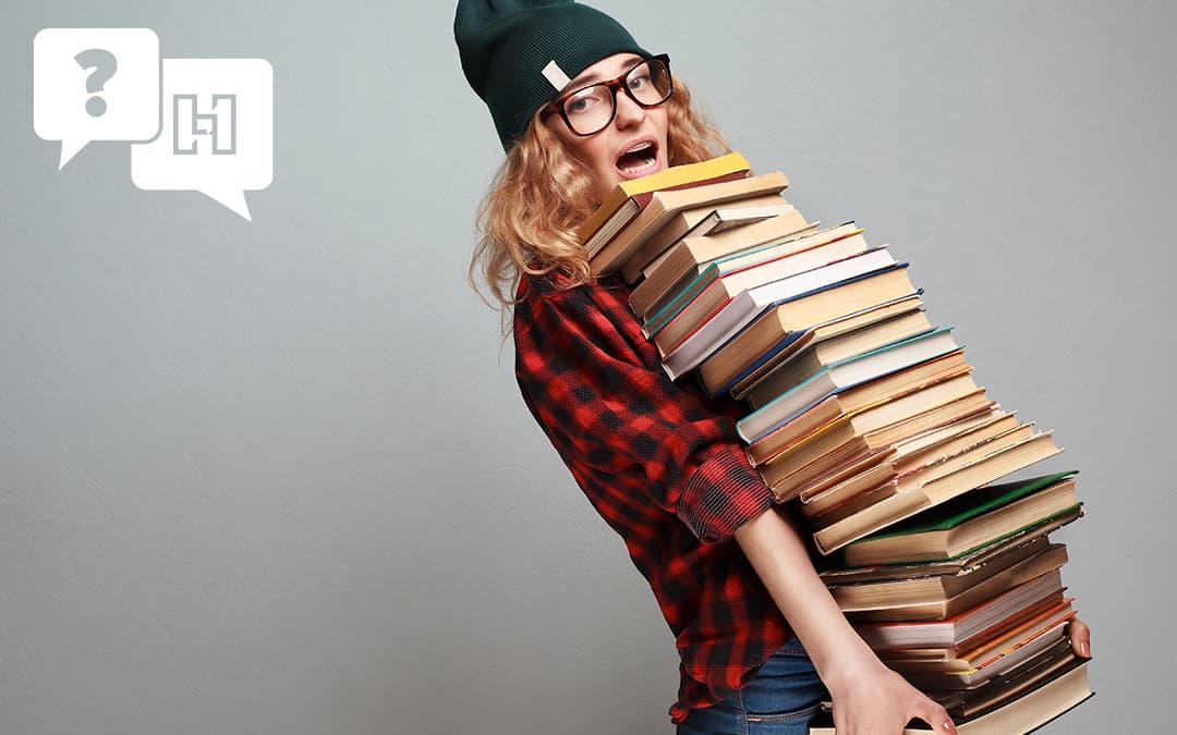 Girl carrying too many books